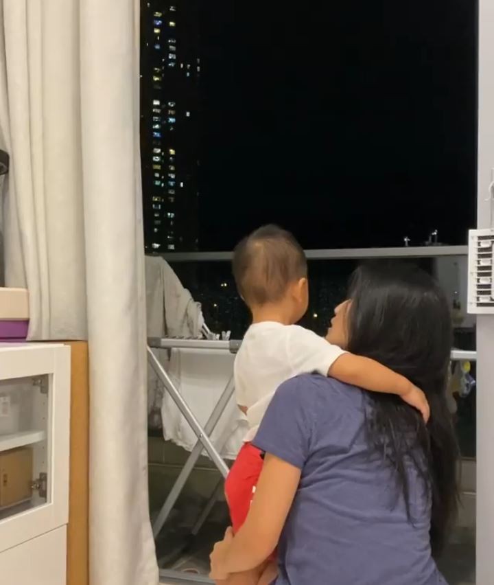 coffee lam watching thunder with her son.