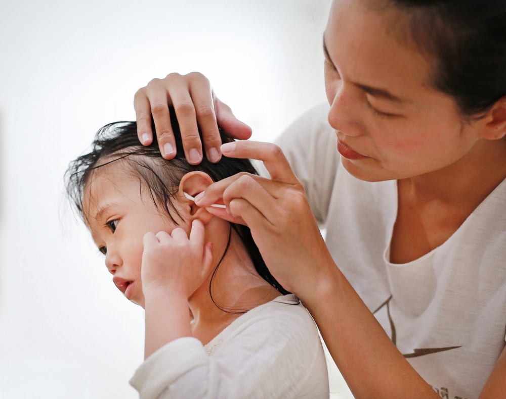girl ears cleaning.