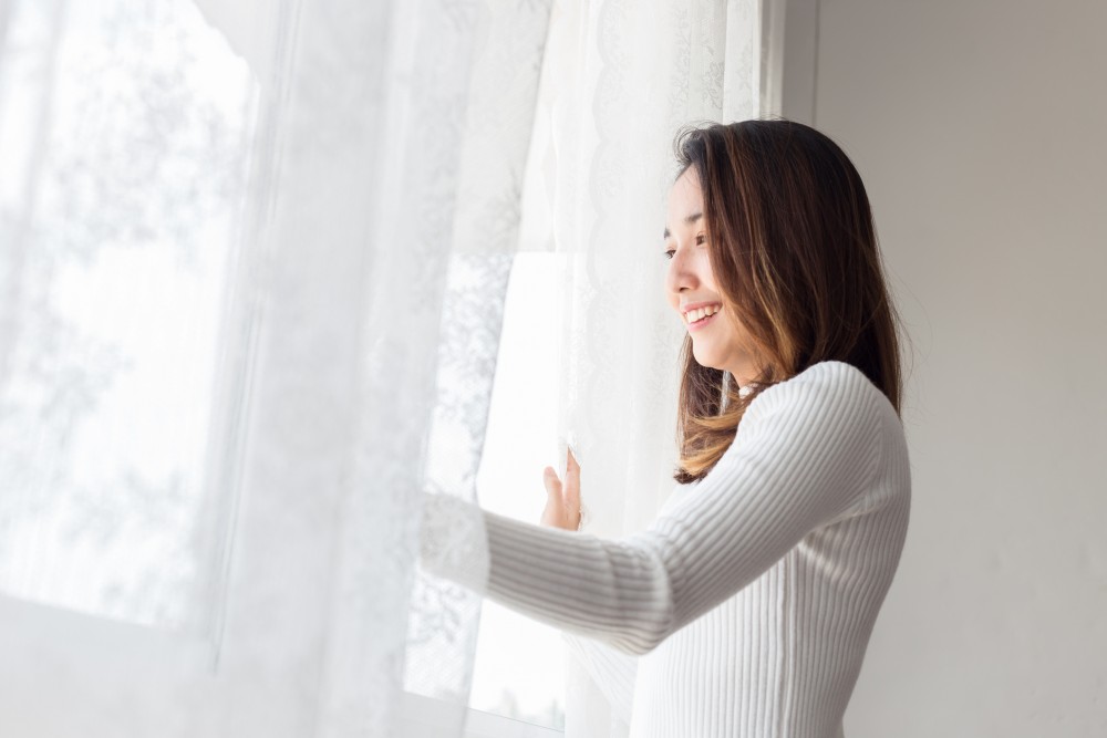 mother opening window.